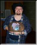 Daniel Gadd with a hat full of money. Nearly  $800 was collected for Cooma Hospital.